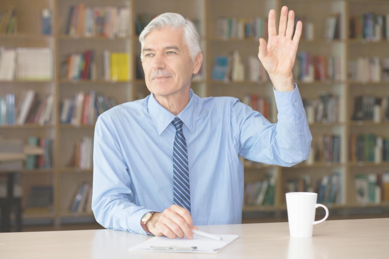 Team member analyzing performance metrics on multiple monitors