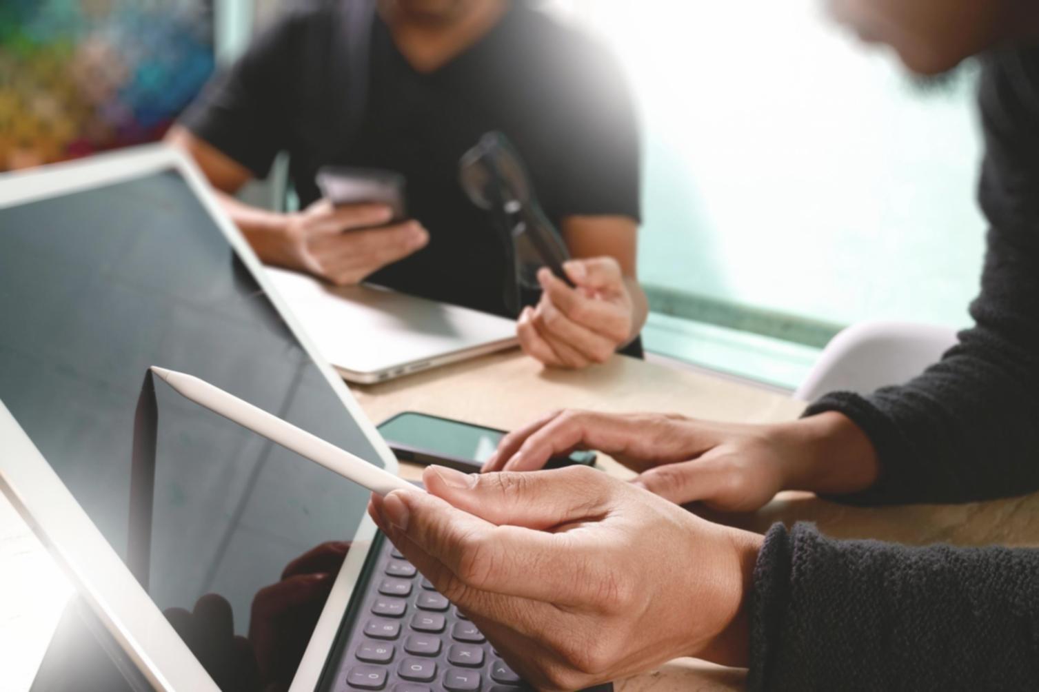 Support team workspace showing monitoring systems and performance testing tools